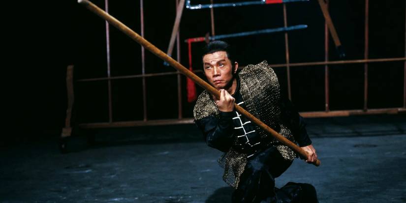 Lau Kar Leung welds a bo staff in Legendary Weapons of China