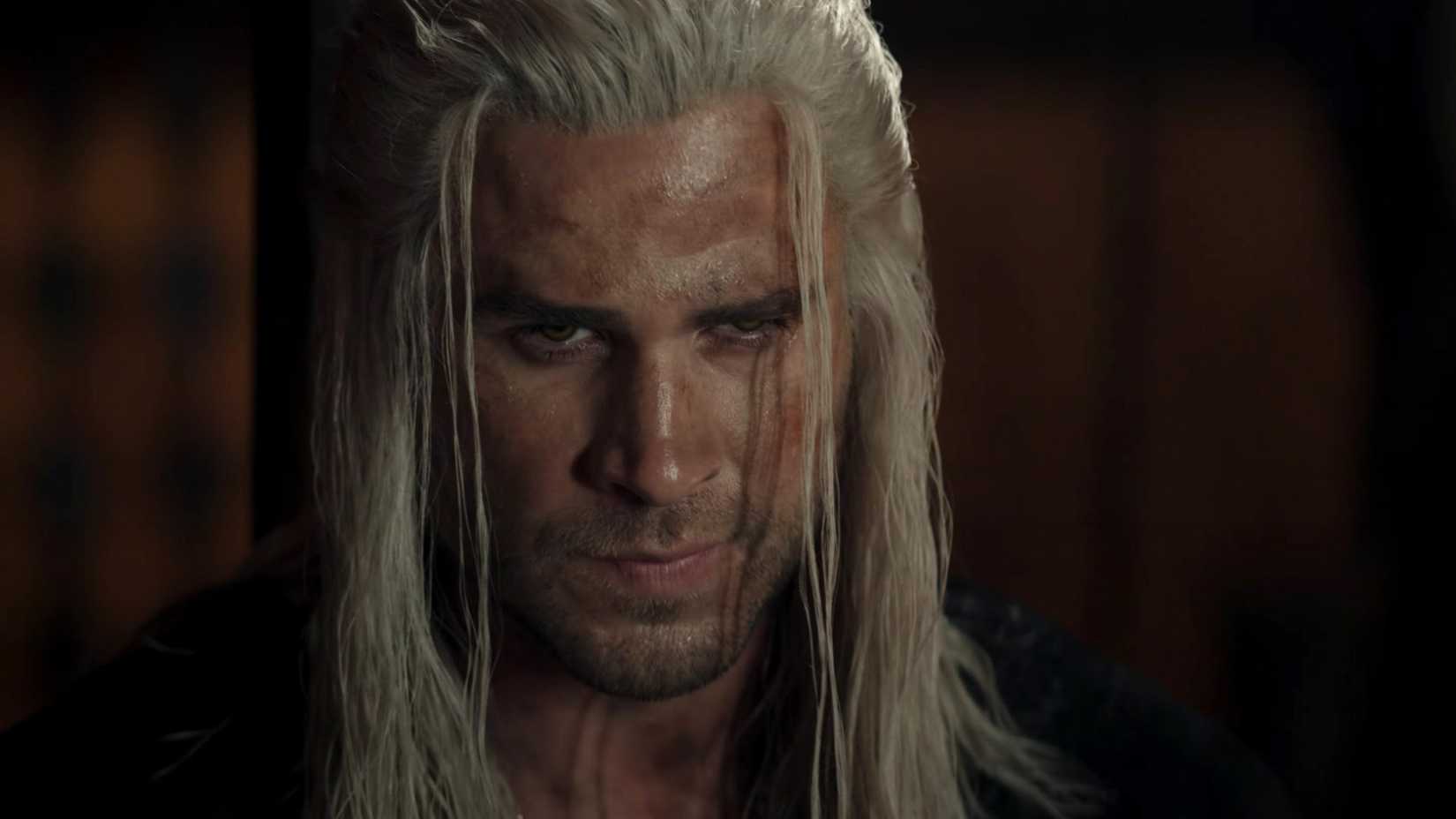Liam Hemsworth Is A Serviceable Geralt After Henry Cavill's Departure But Much Of The Magic Is Gone Liam Hemsworth as Geralt of Rivia looking at someone off screen in The Witcher season 4
