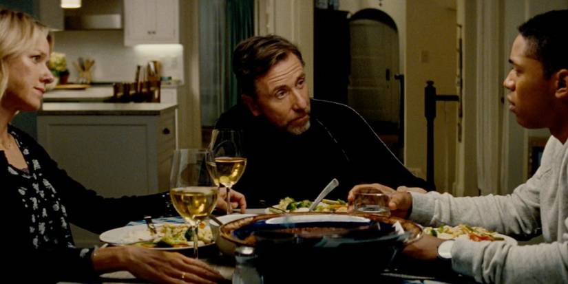 Parents talk to their son at dinner in Luce