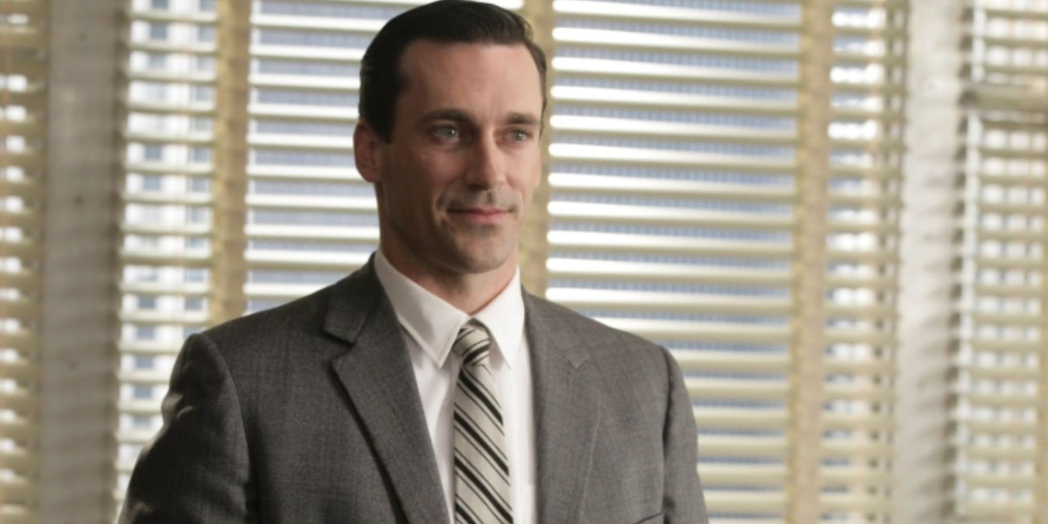 Don Draper e Peggy Olson em uma cena de Mad Men