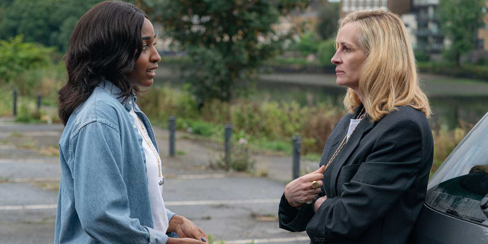 Maggie talking to a severe looking Alma in After the Hunt
