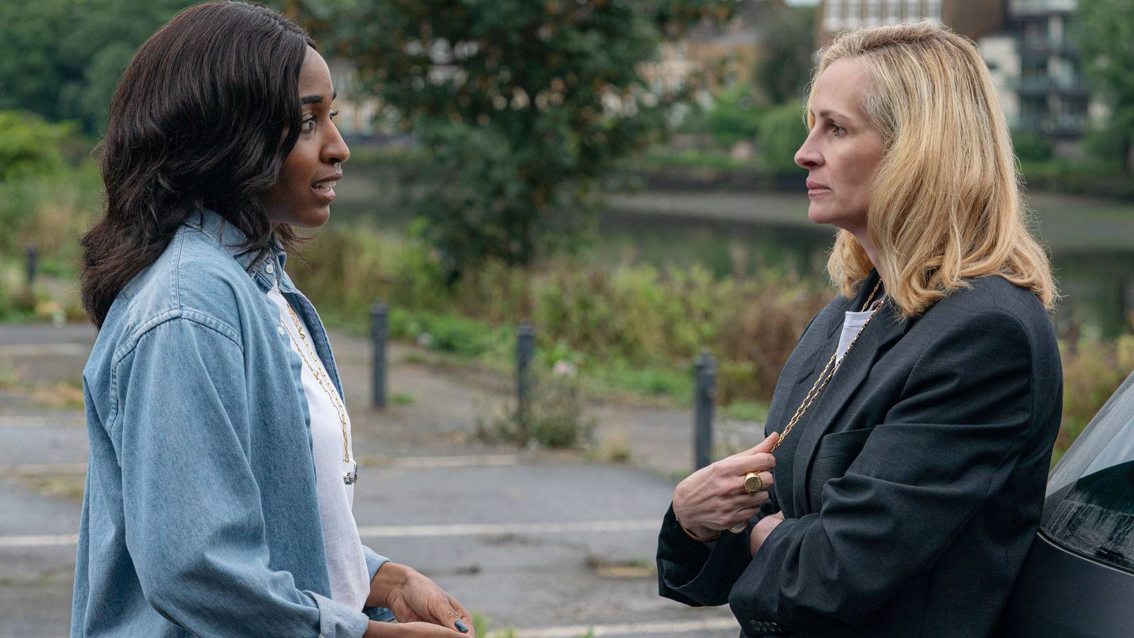 Maggie talking to a severe looking Alma in After the Hunt