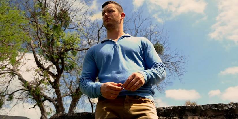 Married At First Sight season 19's Josh wearing a blue shirt and khaki pants outside.