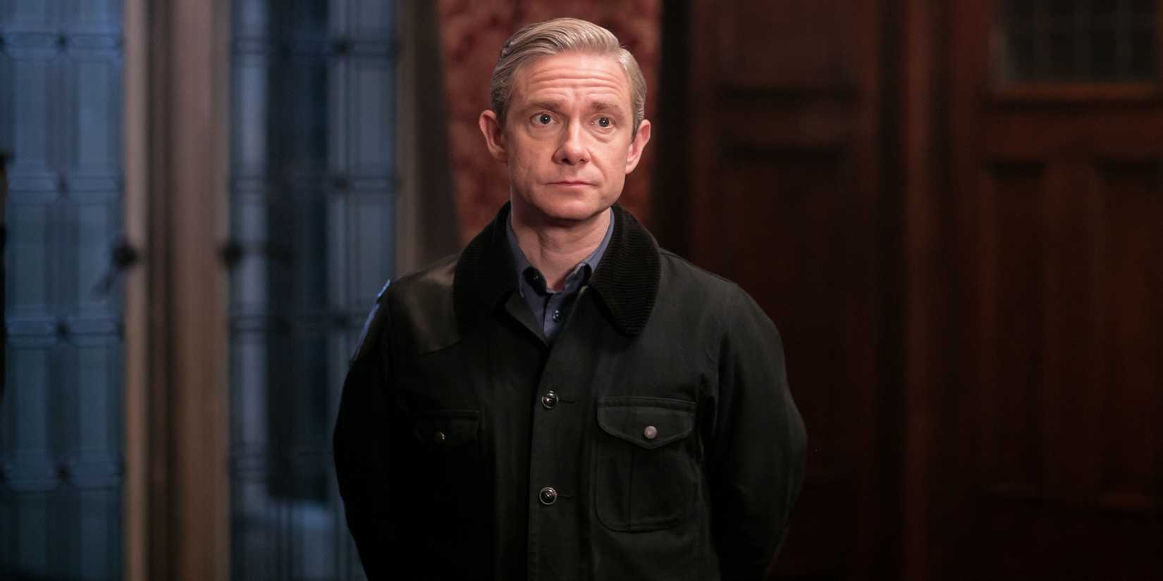 Martin Freeman as John Watson standing in a big room in Sherlock