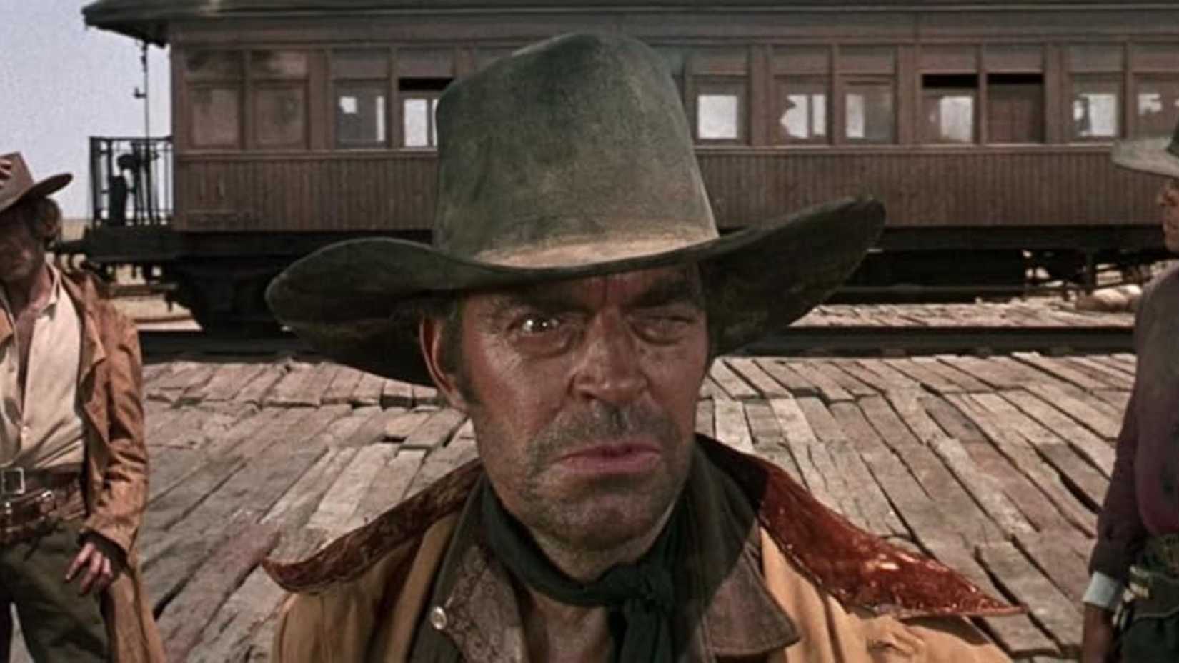 Snaky looks angry while standing in front of the train in Once Upon a Time in the West