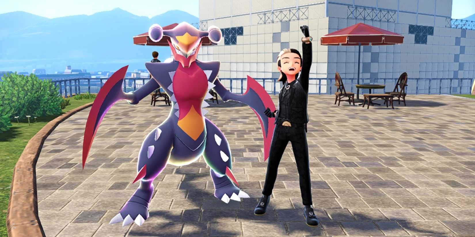 A Trainer poses next to their Mega Garchomp in Pokemon Legends Z-A.
