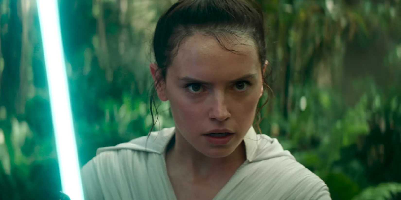 Daisy Ridley as Rey holding a lightsaber in Star Wars: The Rise of Skywalker