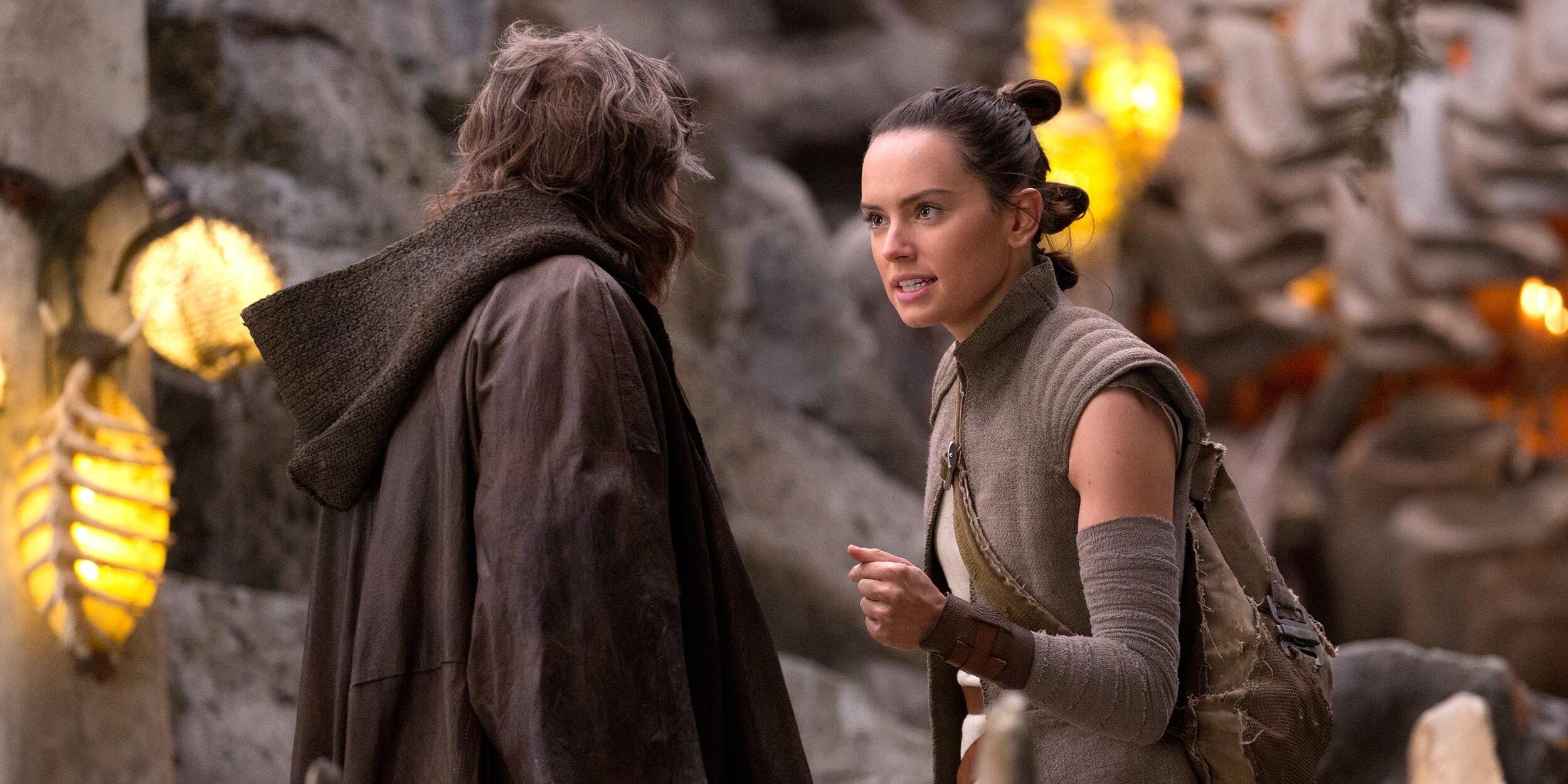 Daisy Ridley as Rey speaking to Mark Hamill as Luke Skywalker in The Last Jedi