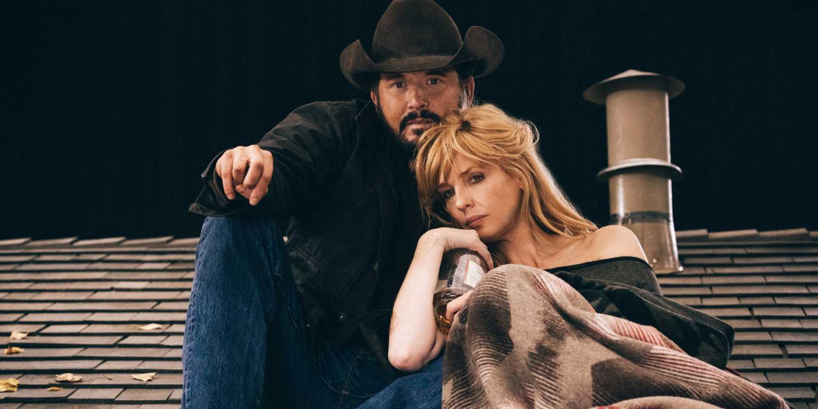 Rip Wheeler (Cole Hauser) and Beth Dutton (Kelly Reilly) on a roof in Yellowstone