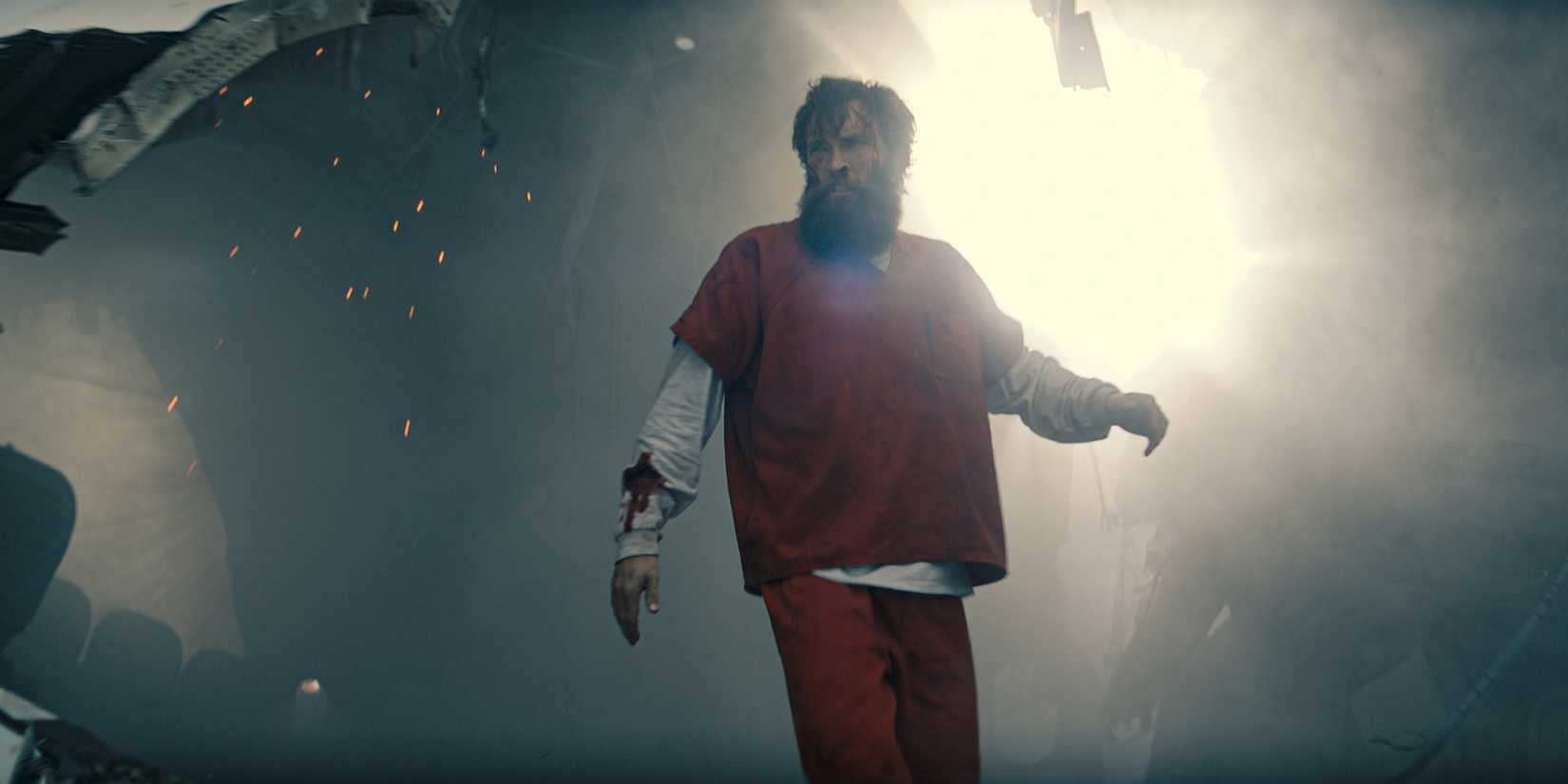 Sam Hargrave as a prisoner coming out of the crashed plane in The Last Frontier