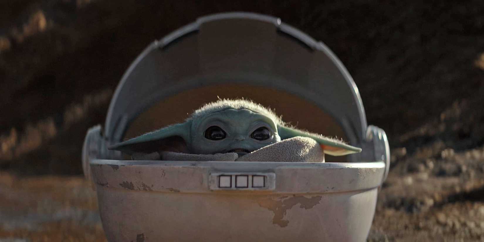 Grogu looks scared on Arvala-7 as he watches Din Djarin fight the mudhorn.