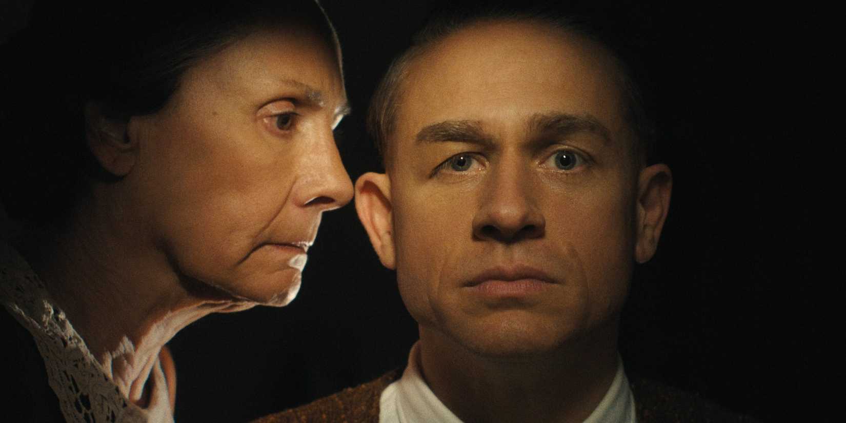 Ed Gein with his mother looking at him in Monster: The Ed Gein Story