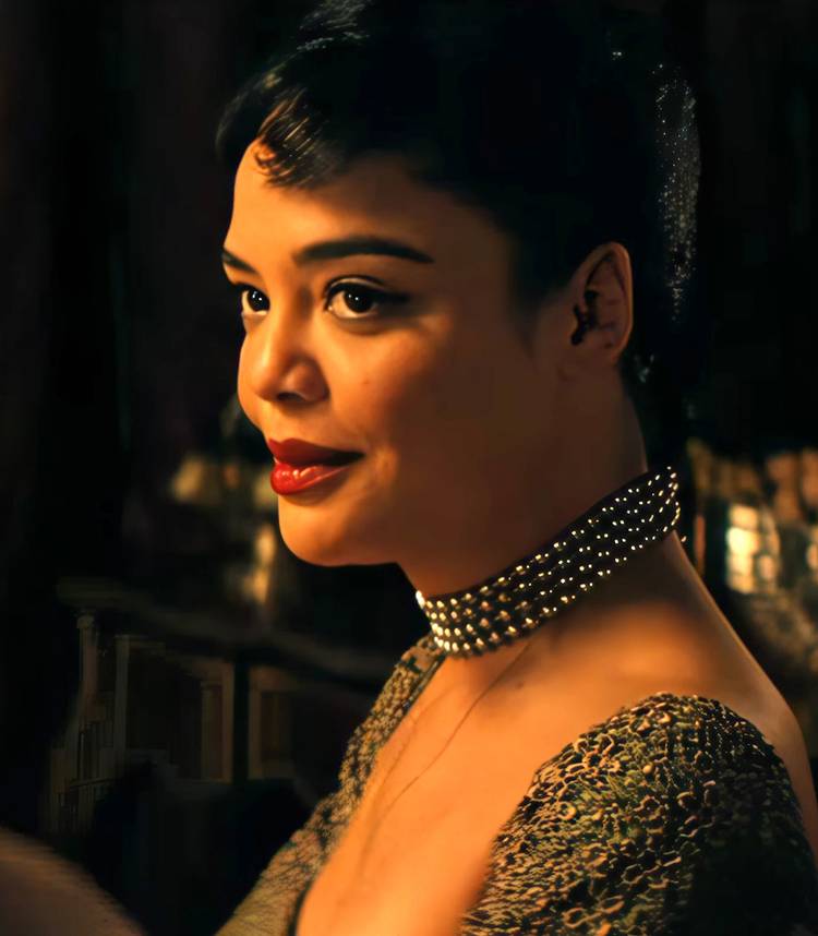 tessa thompson s hedda smiling up toward eileen in hedda