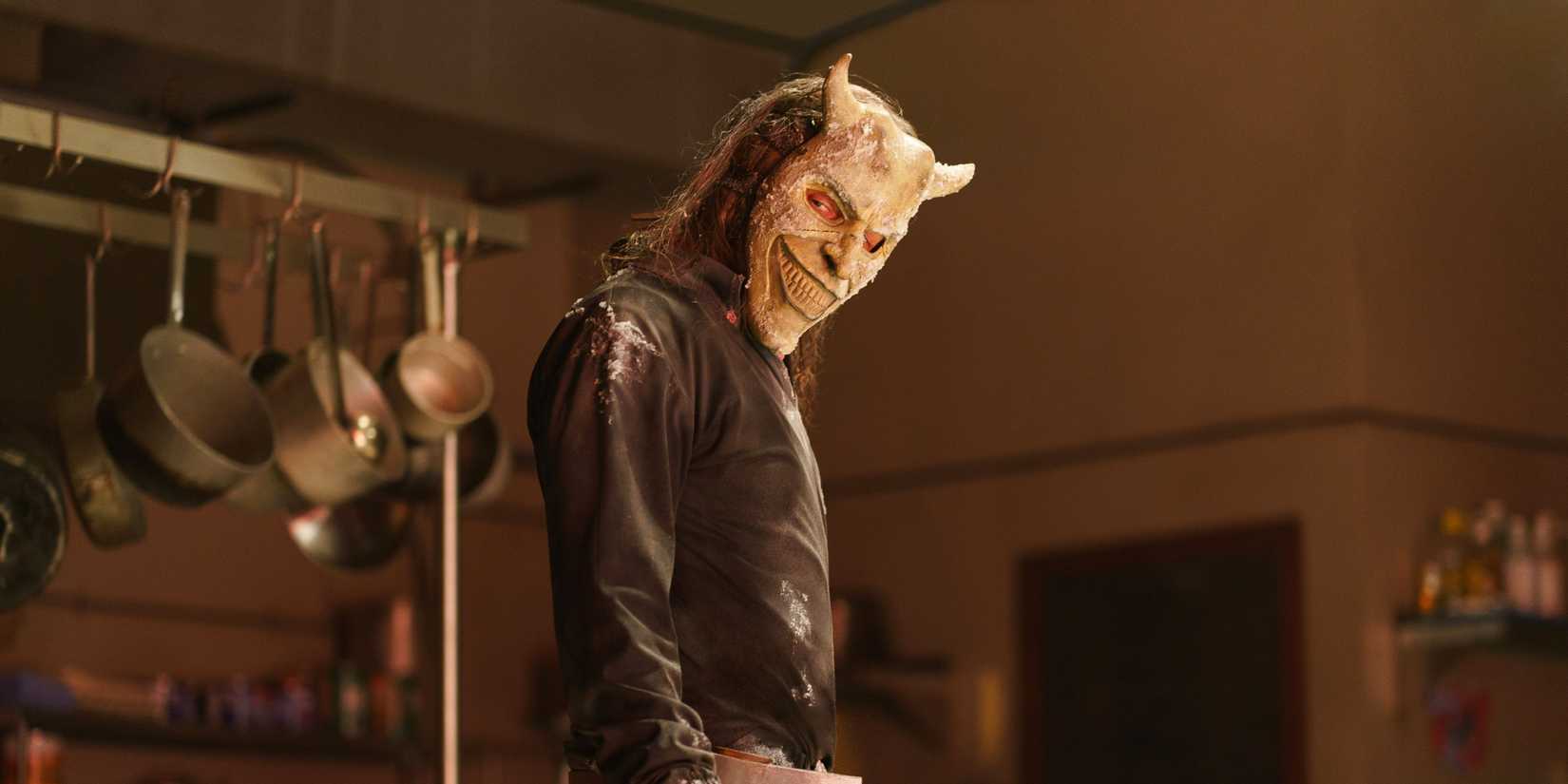 The Grabber (Ethan Hawke) standing with his head tilted to the side in Black Phone 2