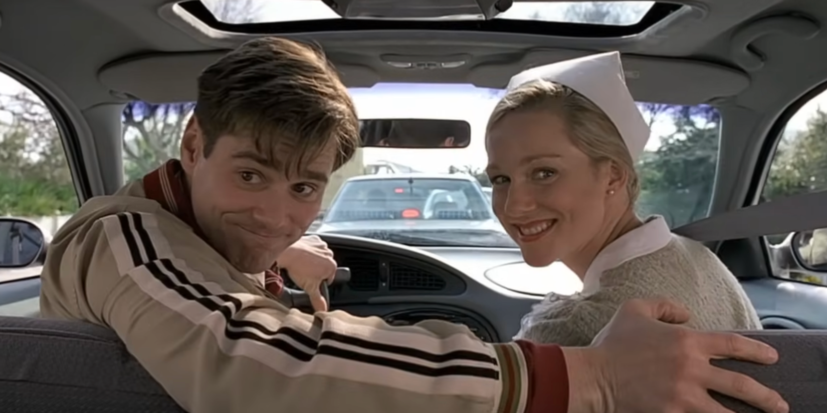 Truman e Meryl no carro em O Show de Truman
