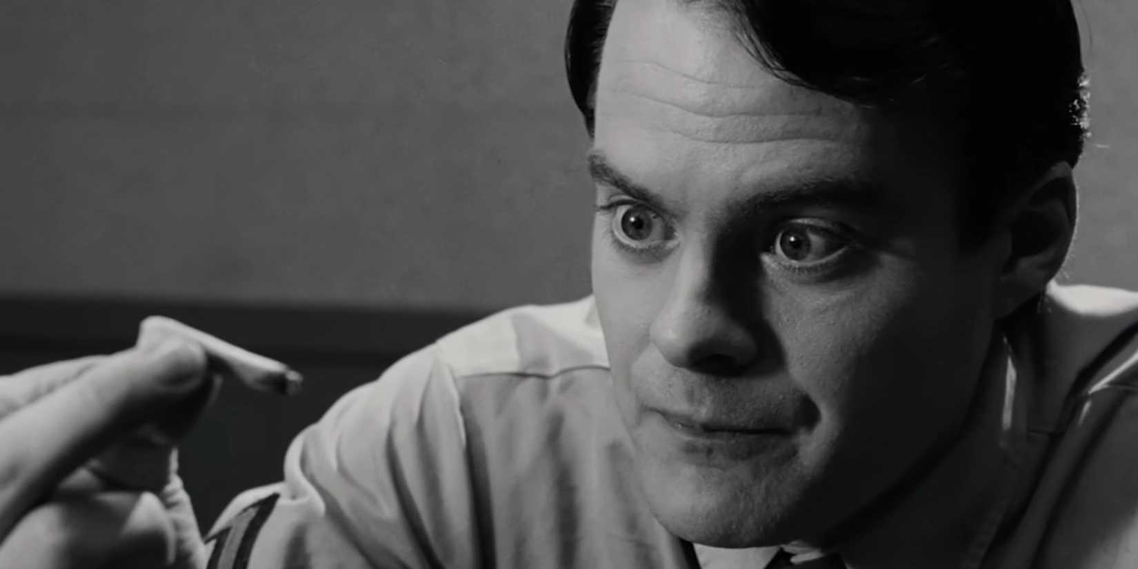 Bill Hader as Private Miller looking at a joint after puffing on it, while locked in a room, in Pineapple Express.
