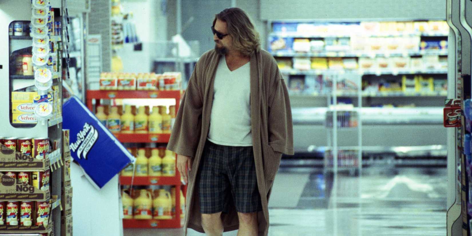 Jeff Bridges as the Dude, wearing a dirty robe and t-shirt, wandering around a supermarket in The Big Lebowski.