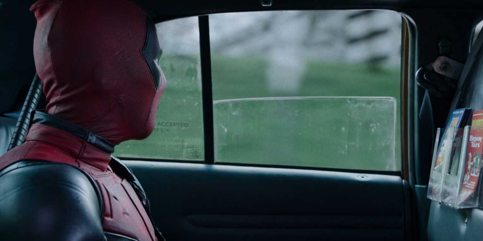 ᴅᴇᴀᴅpool riding in a cab, playing with the back window childishly, in ᴅᴇᴀᴅpool.