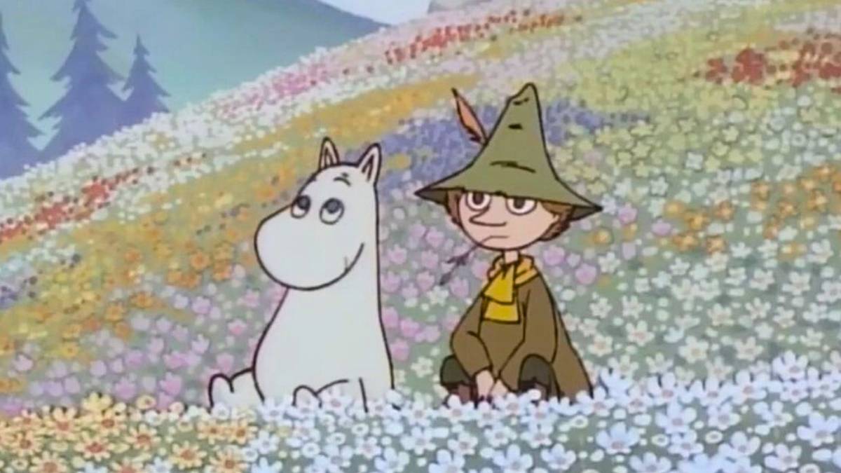 A moomin and a friend sitting in a meadow of flowers