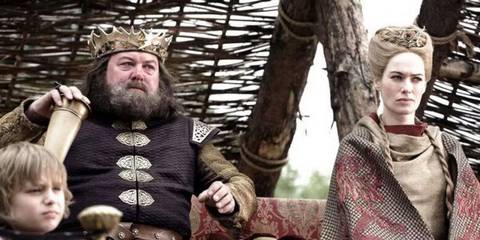 Cersei and Robert looking bored and watching jousting 