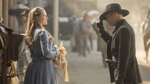 Dolores and The Man In Black facing each other in the street
