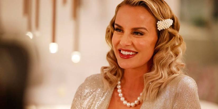 Whitney Rose smiling off camera on RHOSLC