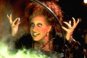 Winnifred looking into a cauldron looking happy in Hocus Pocus