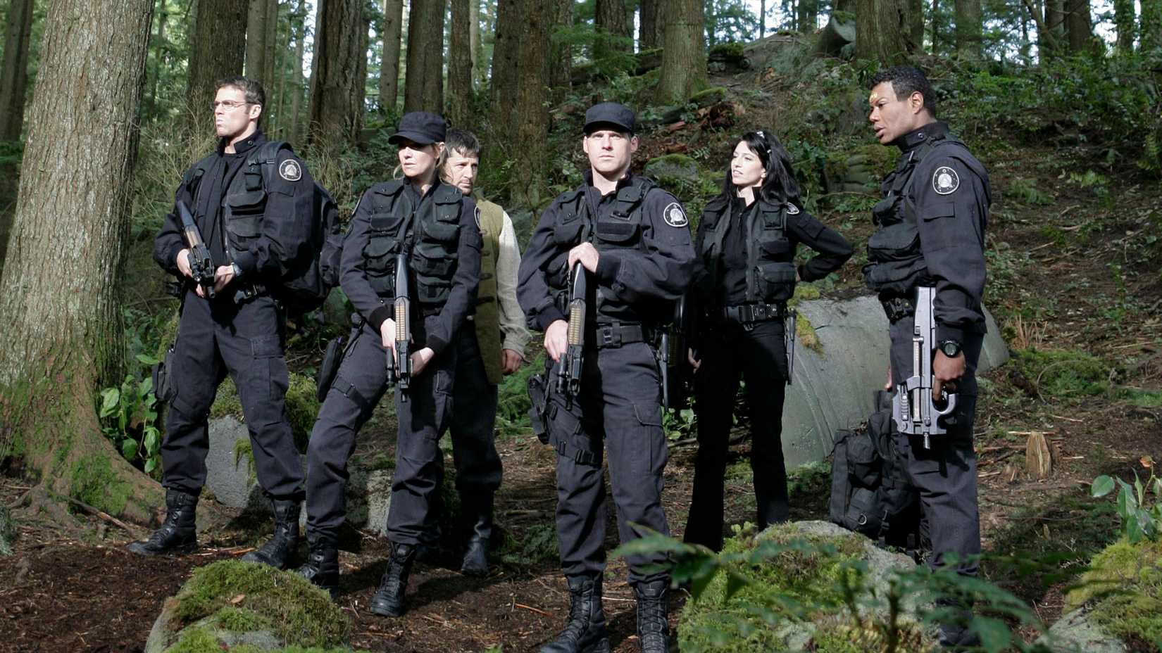 A group of troops stand in the woods in Stargate Ark of Truth