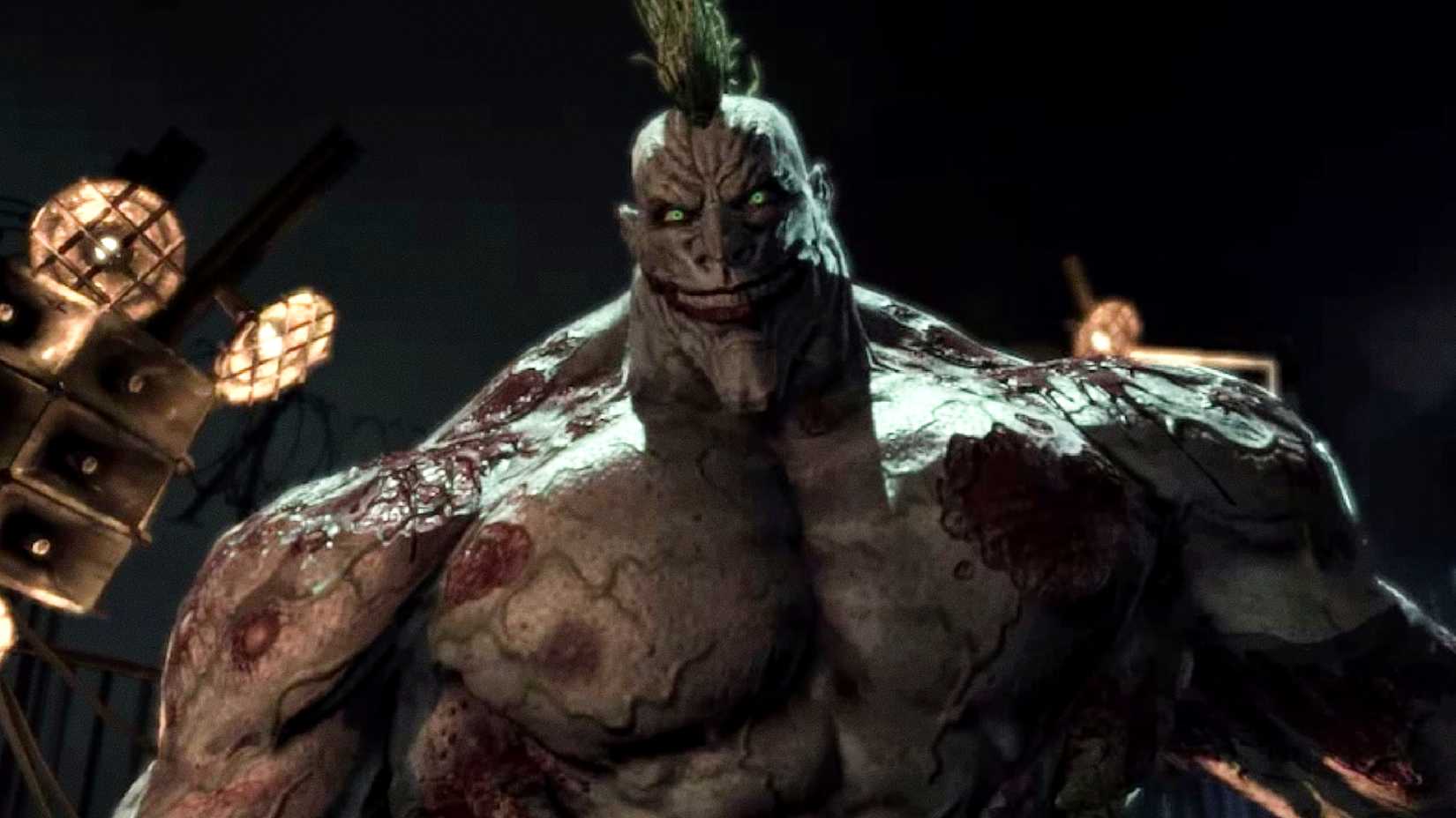 A Venom-powered monster Joker smiles at night in Batman Arkham Asylum's final battle