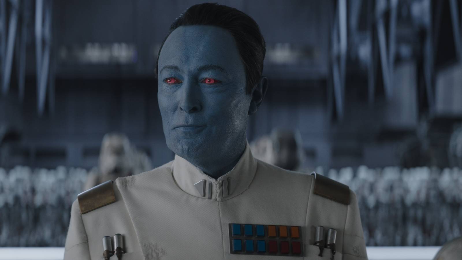 Grand Admiral Thrawn (Lars Mikkelsen) smiling in Ahsoka season 1