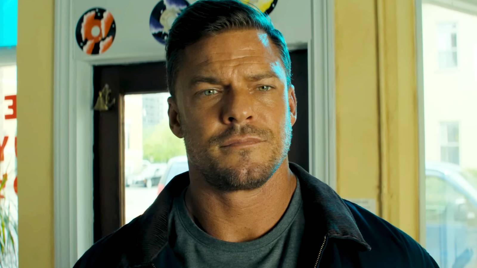 Alan Ritchson staring at someone in Reacher season 3