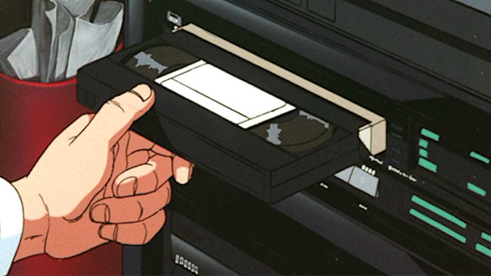 Anime character putting a VHS into a VCR