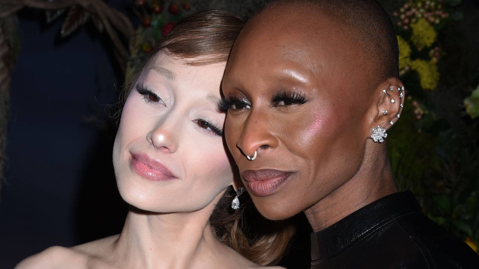 Ariana Grande and Cynthia Erivo posing together on a red carpet for Wicked For Good