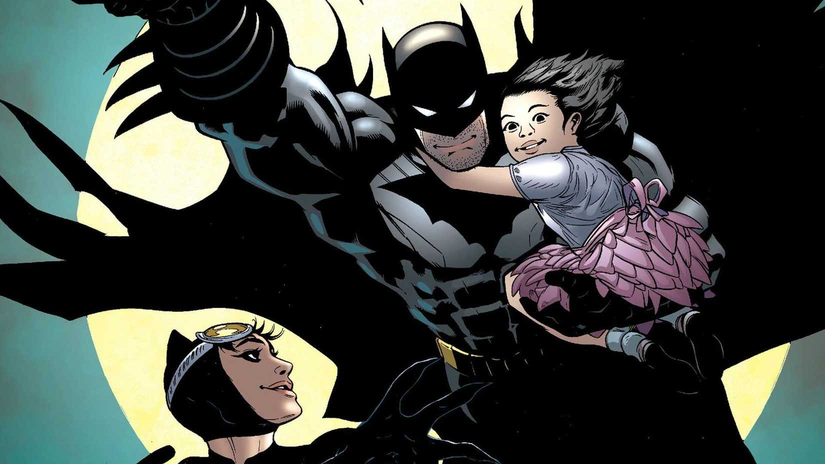 Batman carries a young girl smiling accompanied by Catwoman in front of the full moon