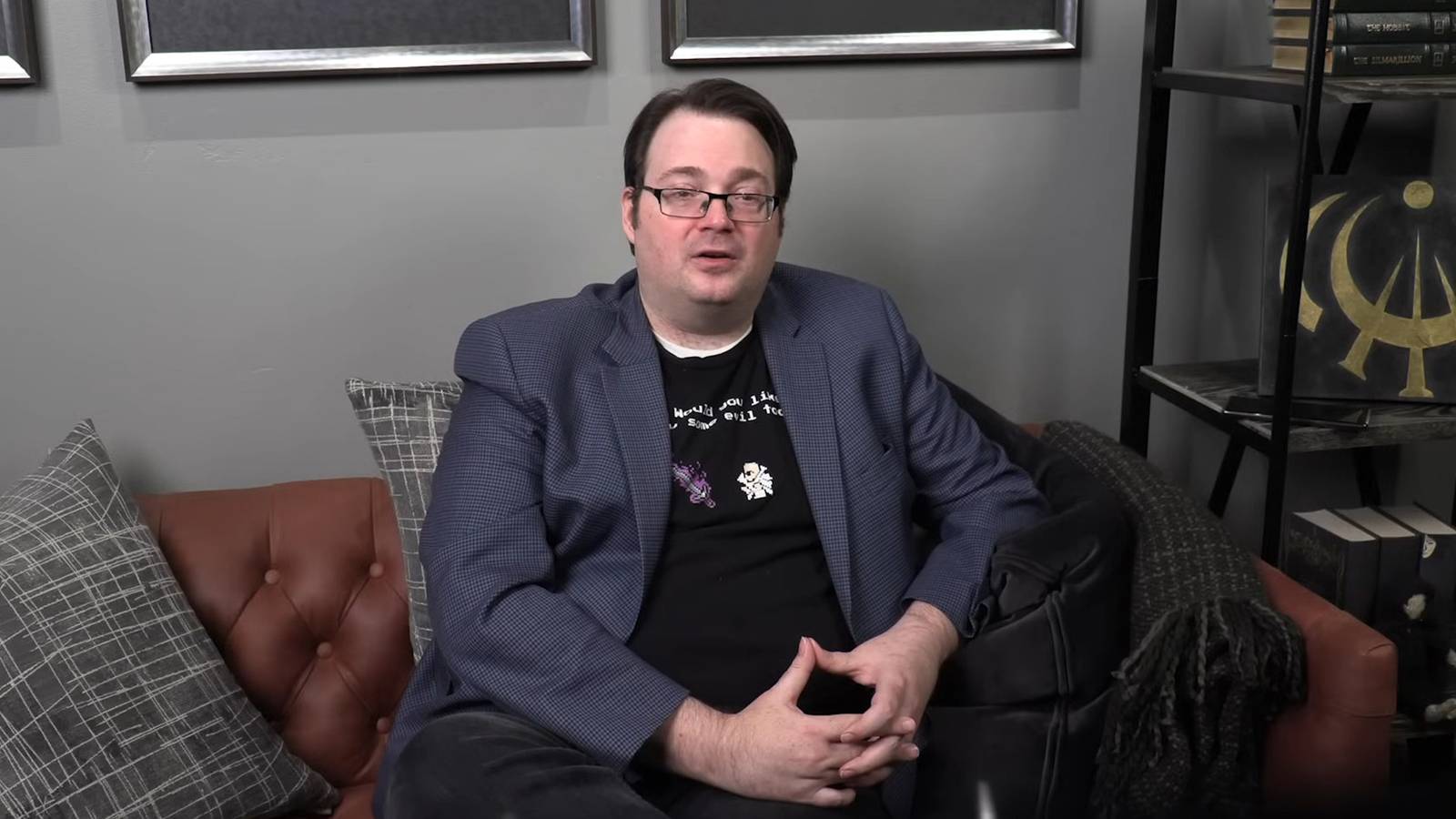 Brandon Sanderson sitting on a couch