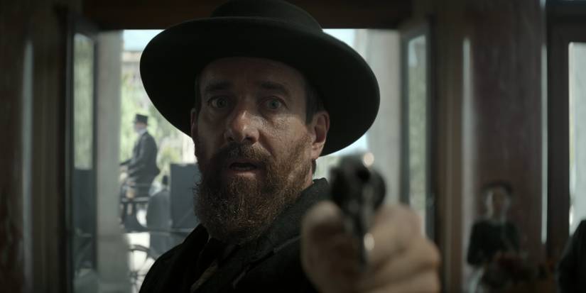 Charles Guiteau holds up a pistol in Death by Lightning