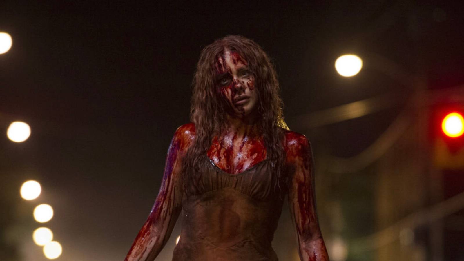 Chloe Grace Moretz' Carrie covered in blood in the street from Carrie 2013