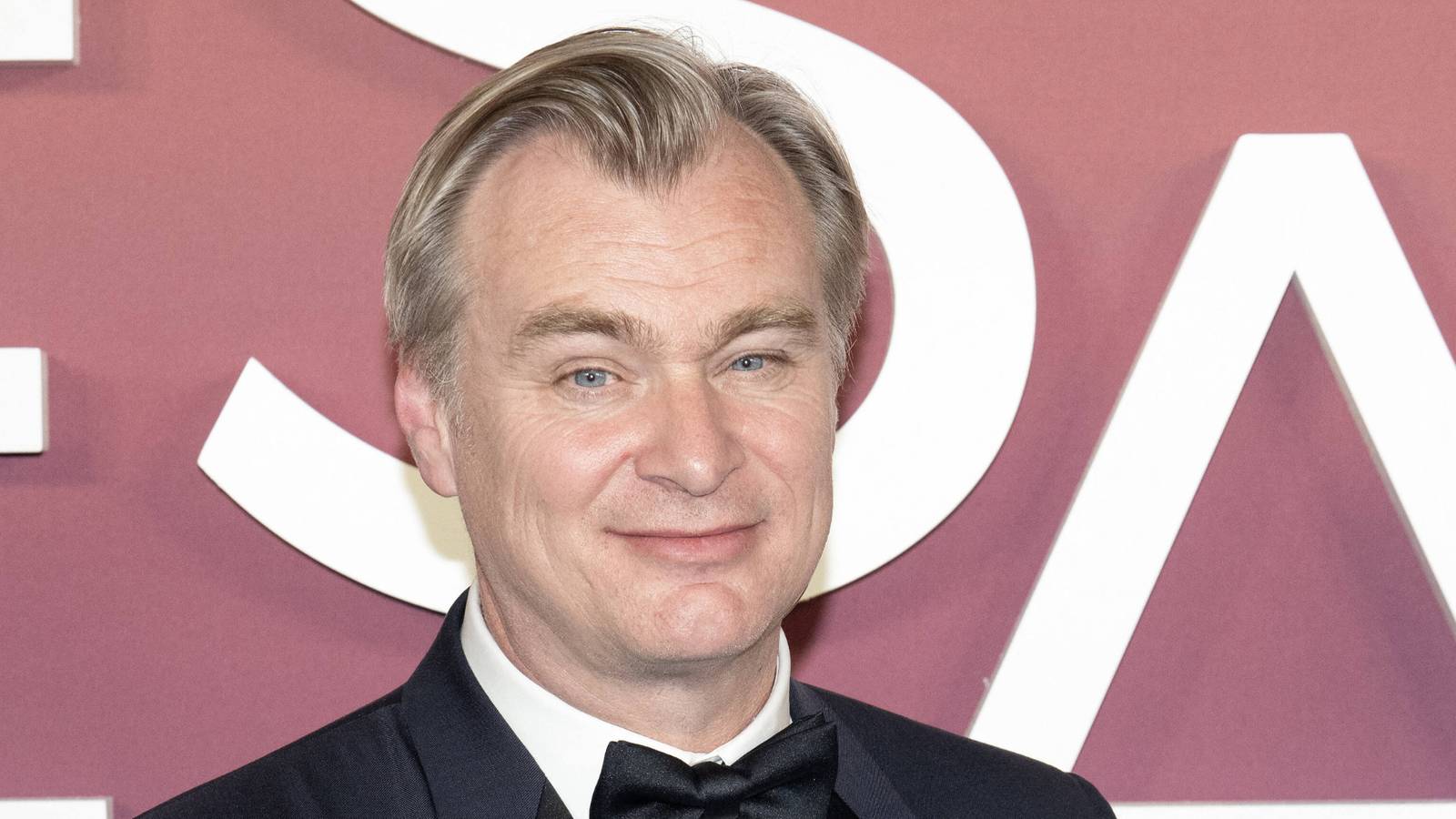 Christopher Nolan with the Honorary Cesar Award poses in the press room during the 49th Cesar Film Awards at L Olympia