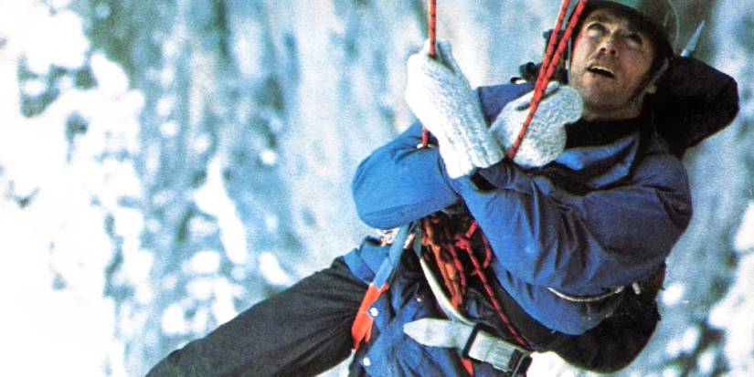 Clint Eastwood as Hemlock hanging from a rope in The Eiger Sanction