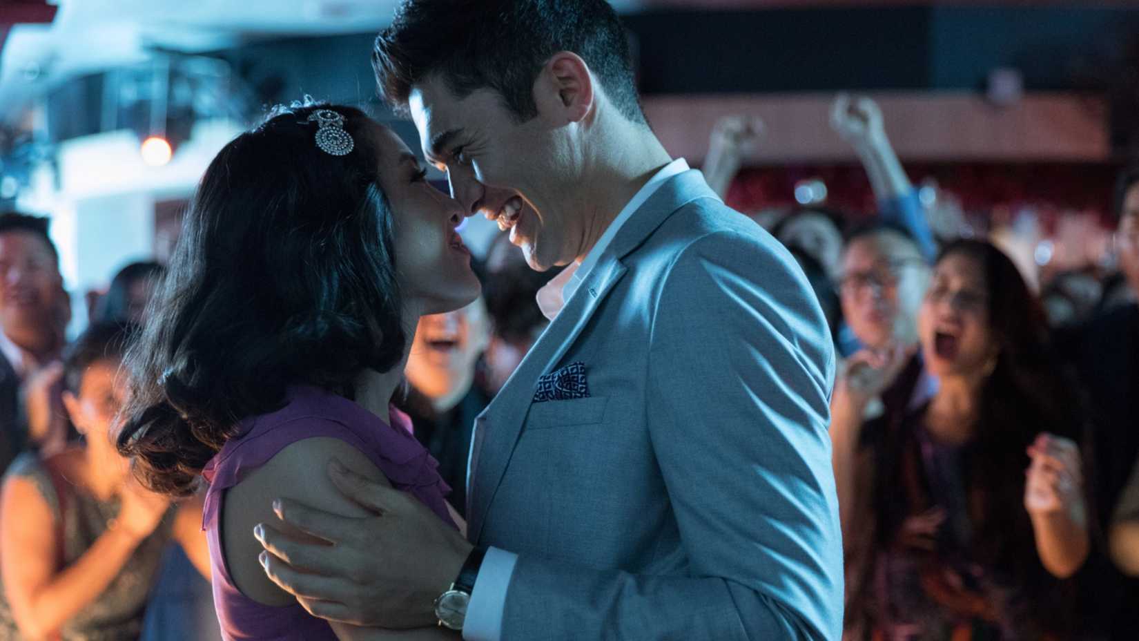 Rachel and Nick smiling together in Crazy Rich Asians