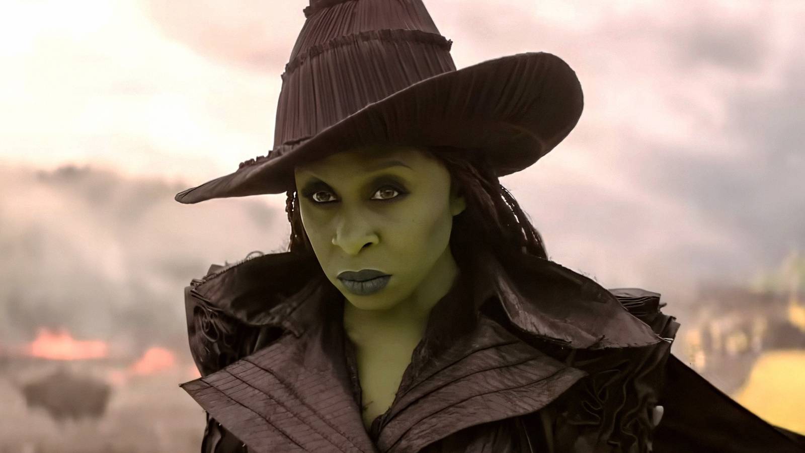 Cynthia Erivo as Elphaba glaring while flying over the yellow brick road in Wicked For Good