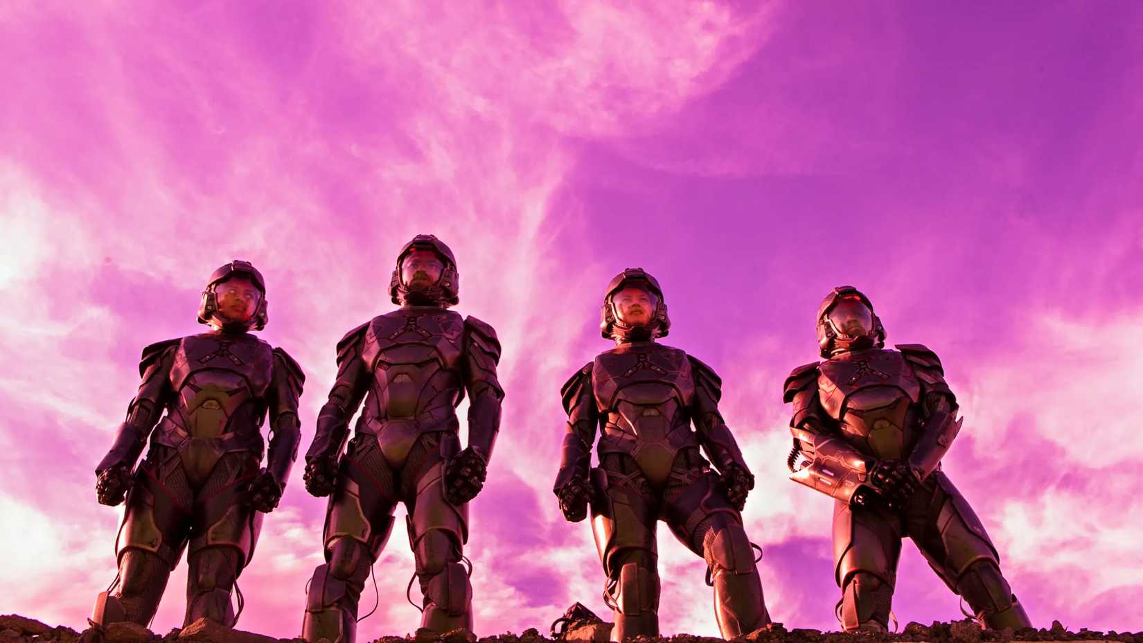 Four Martian soldiers in front of a purple sky in The Expanse