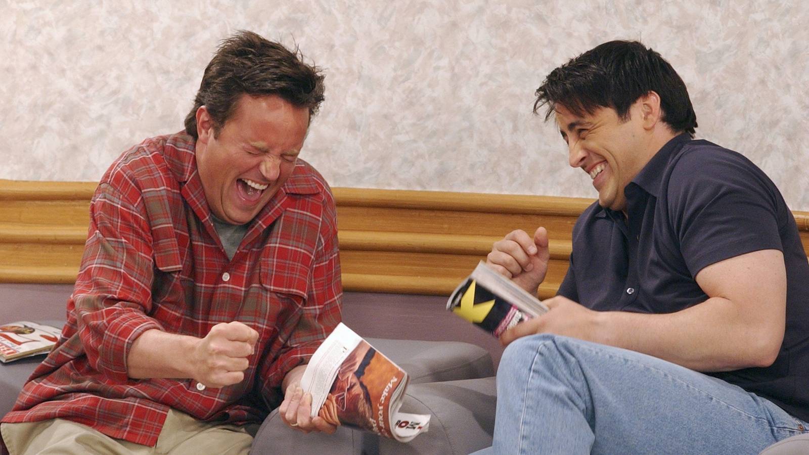 Matthew Perry and Matt LeBlanc laughing behind the scenes in Friends