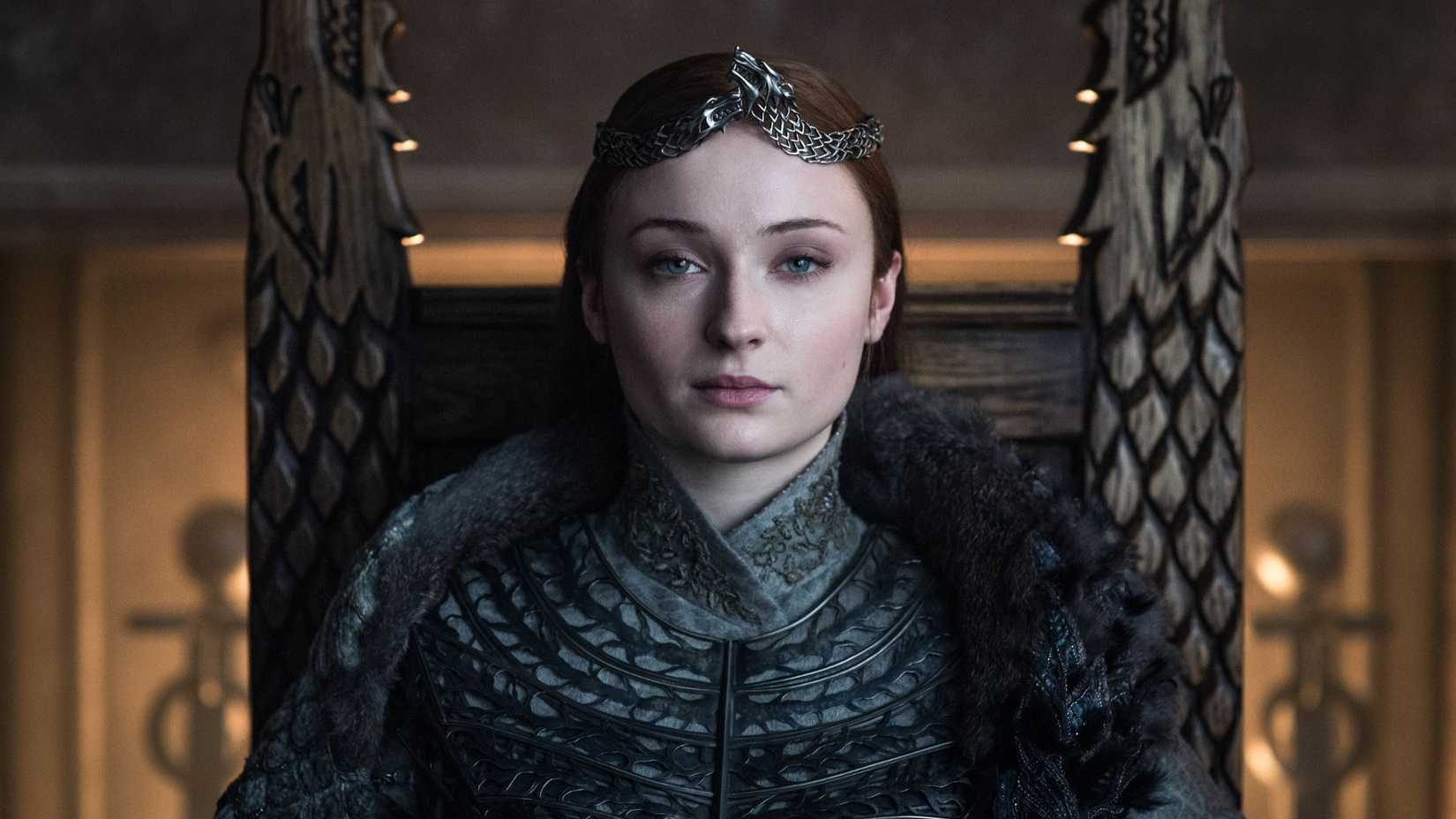 Sansa Stark (Sophie Turner) sitting on the Winterfell Throne in Game of Thrones.