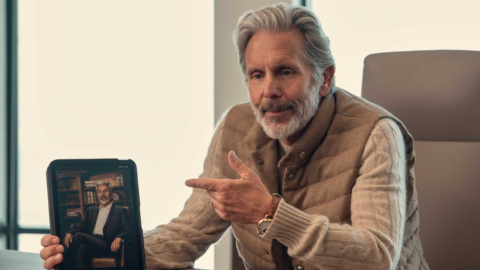 gary cole holding a tablet in a man on the inside