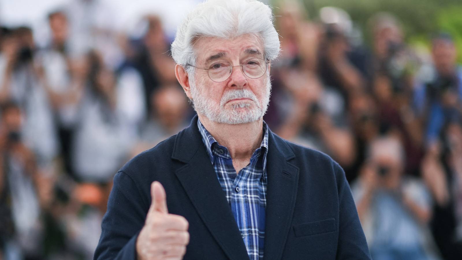 George Lucas attends a photocall as he has been awarded an Honorary Palme d'Or during the 77th Cannes Film Festival in Cannes, France