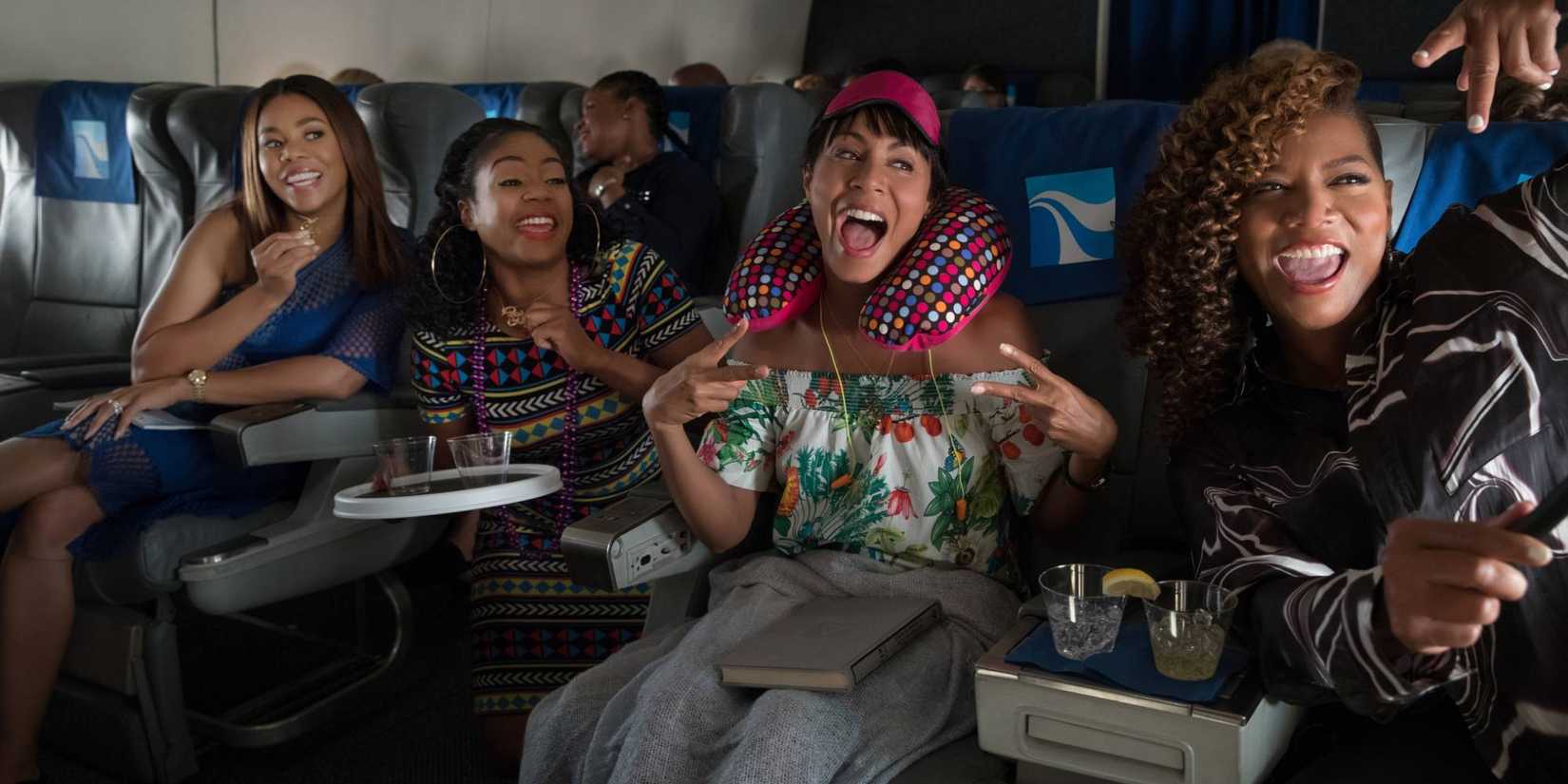 The cast in an airplane in Girls Trip