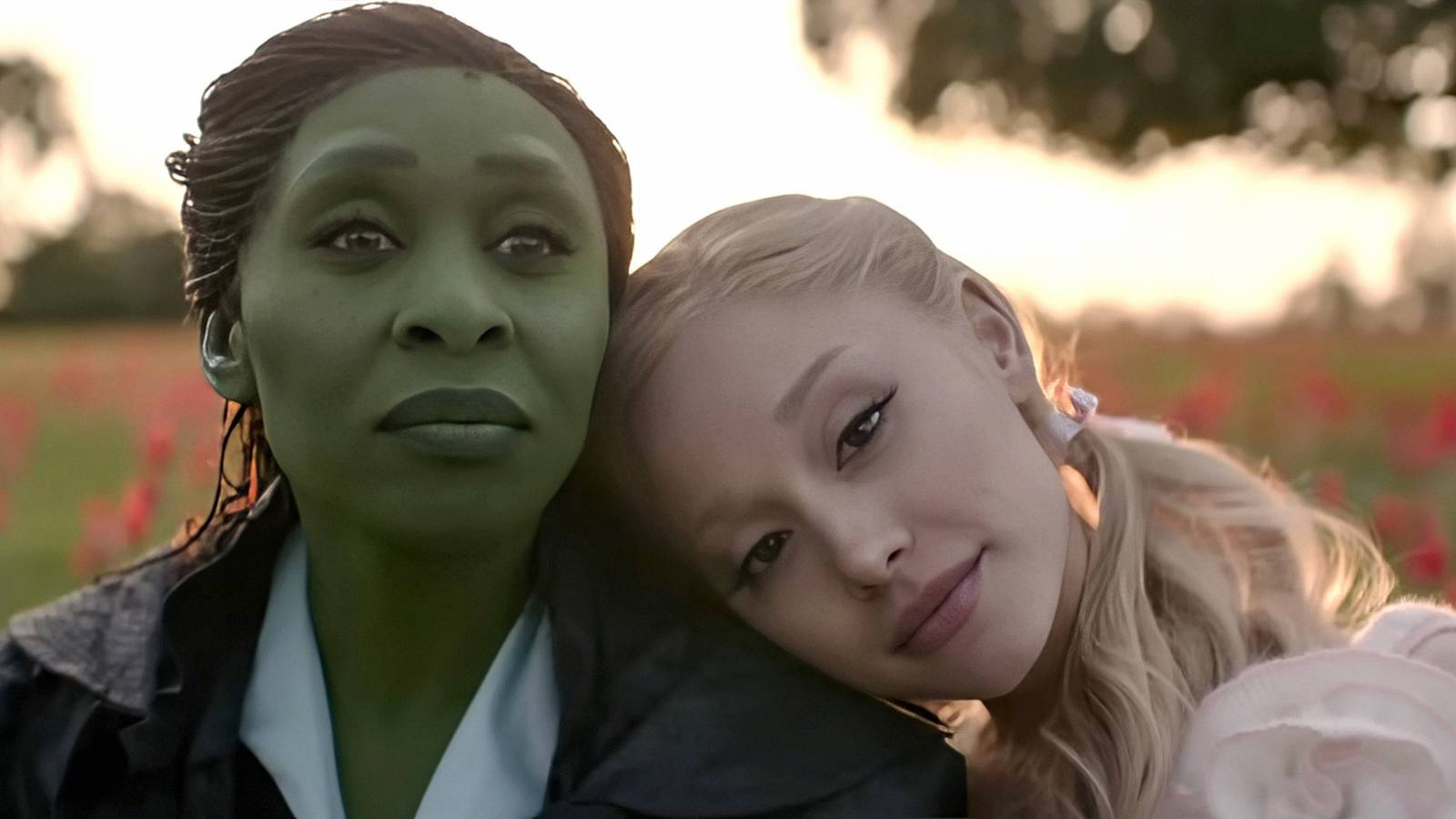 Glinda leaning her head on Elphaba in close-up in Wicked For Good