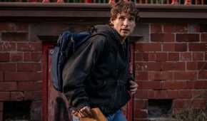 Guy carring an envelope and wearing a backpack in Talamasca The Secret Order