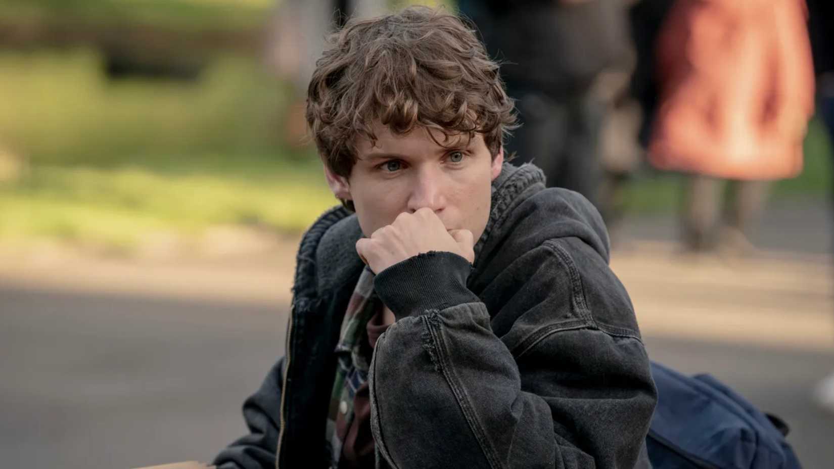 Guy with his hand over his mouth looking worried in Talamasca The Secret Order